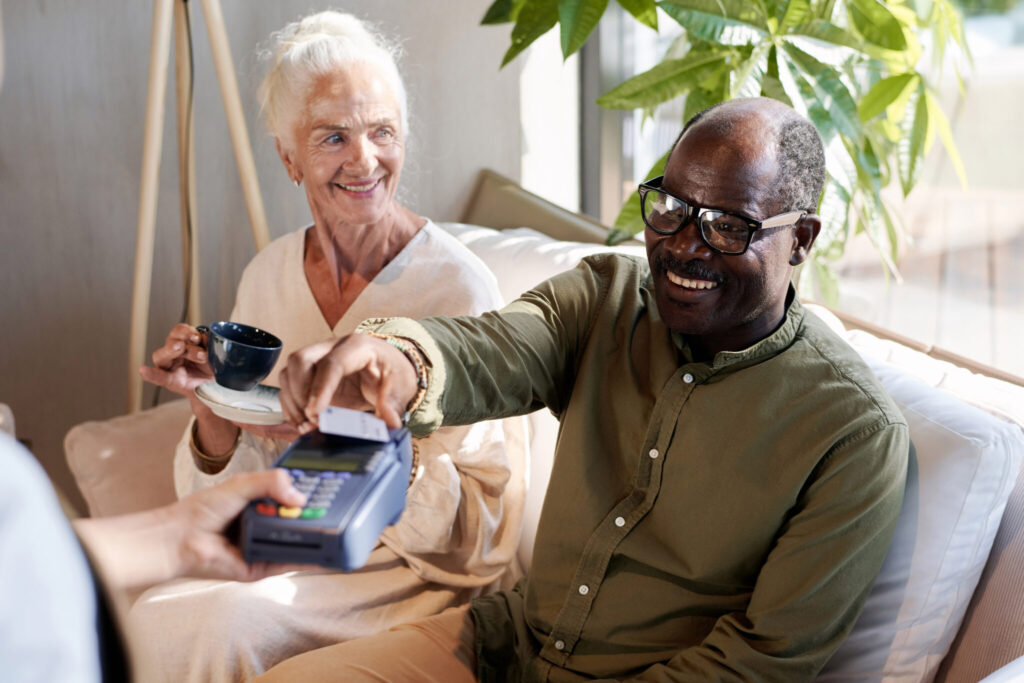 Man paying for coffee with credit card
