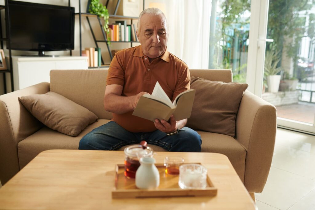Senior Man Reading Detective Story