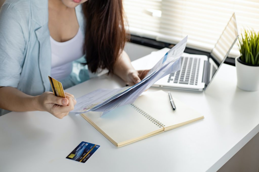 Woman overthink by debt from many credit cards and bills.