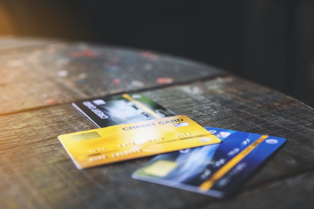 Several credit cards on wooden table