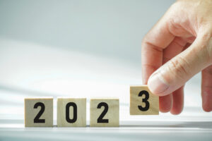 Concept of go to the next year 2023, people handle wooden box for change number of the year.